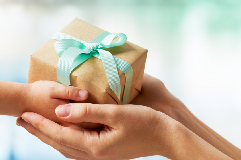 two hands with gift